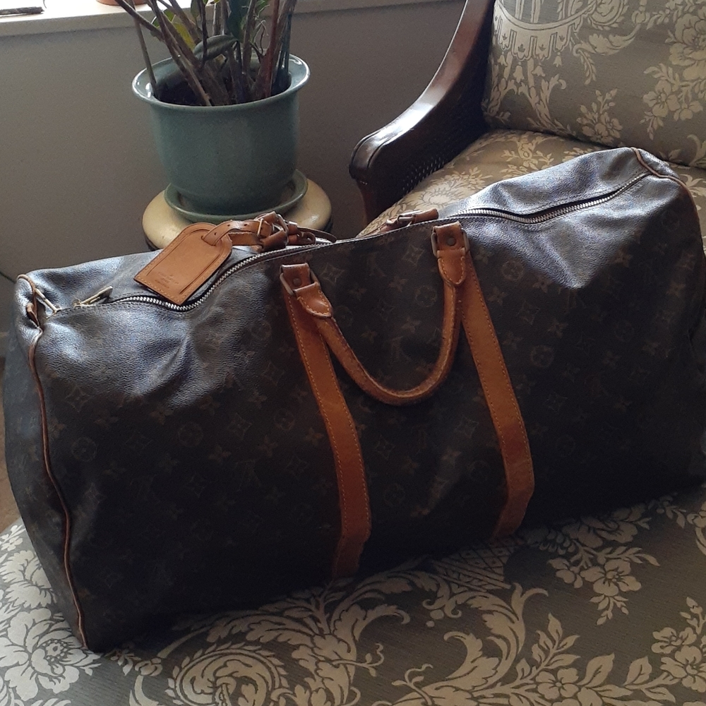 Louis Vuitton duffel.
